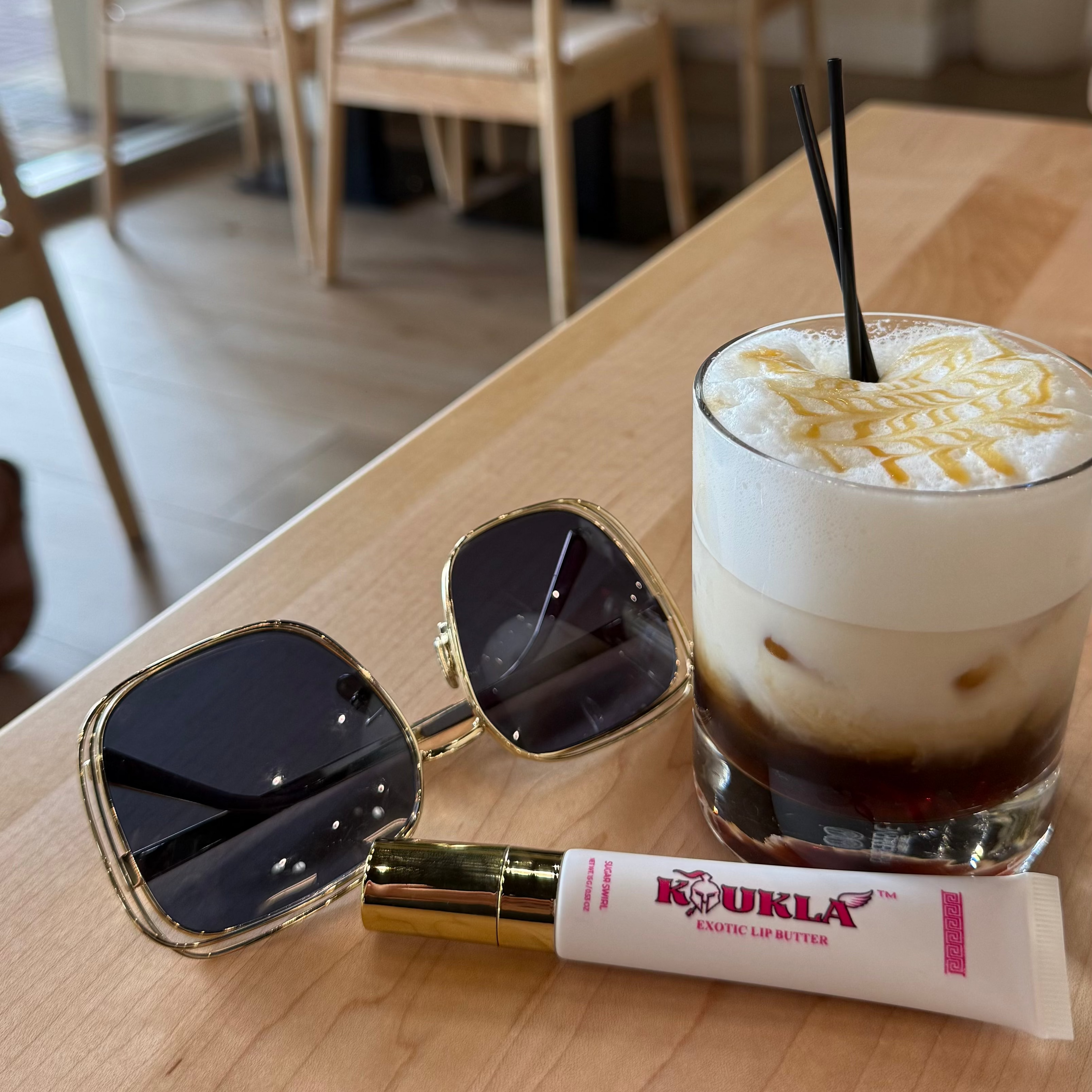 Aesthetic Koukla Lip Butter Next to Coffee
