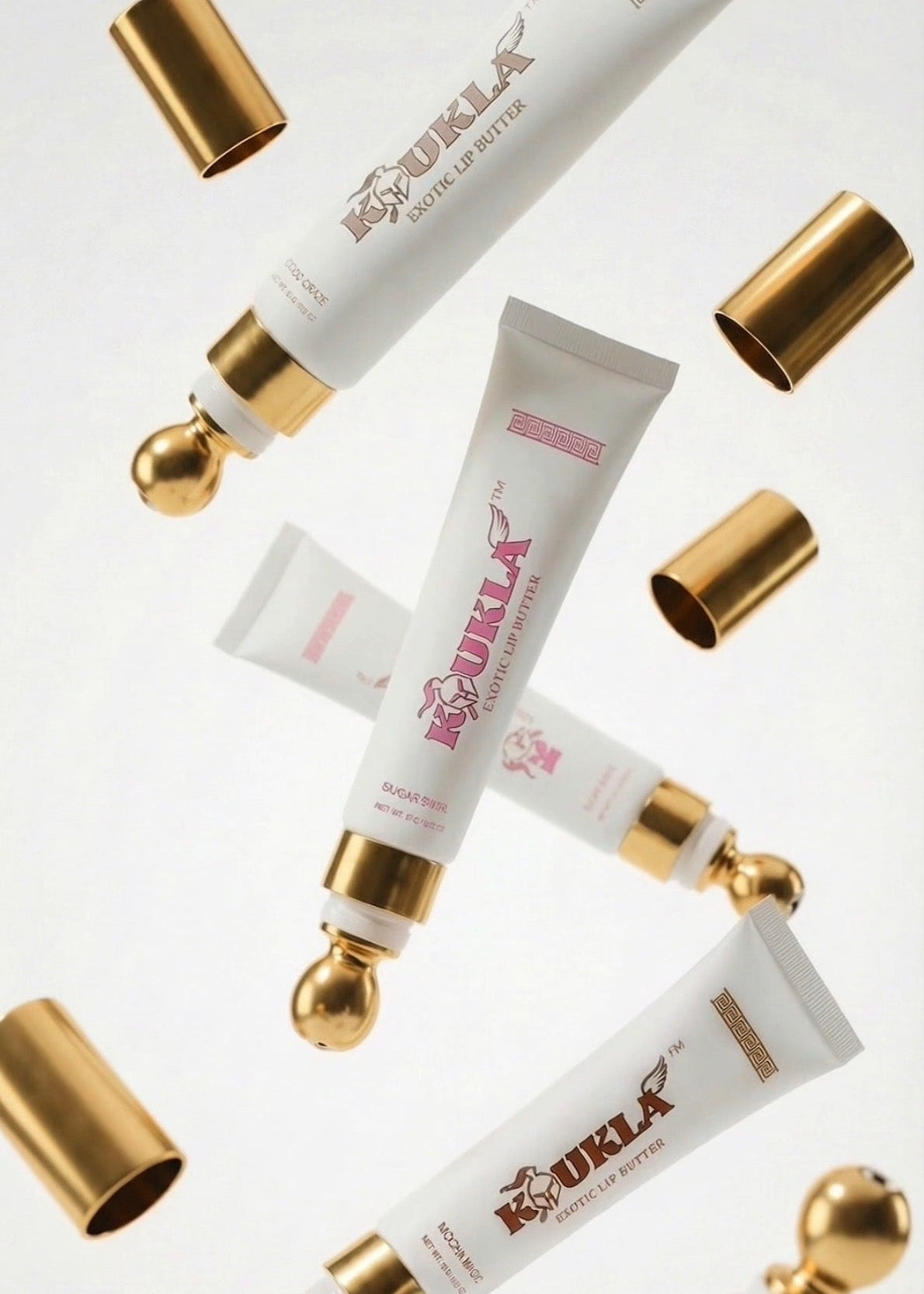 Koukla lip butters with their caps off 
